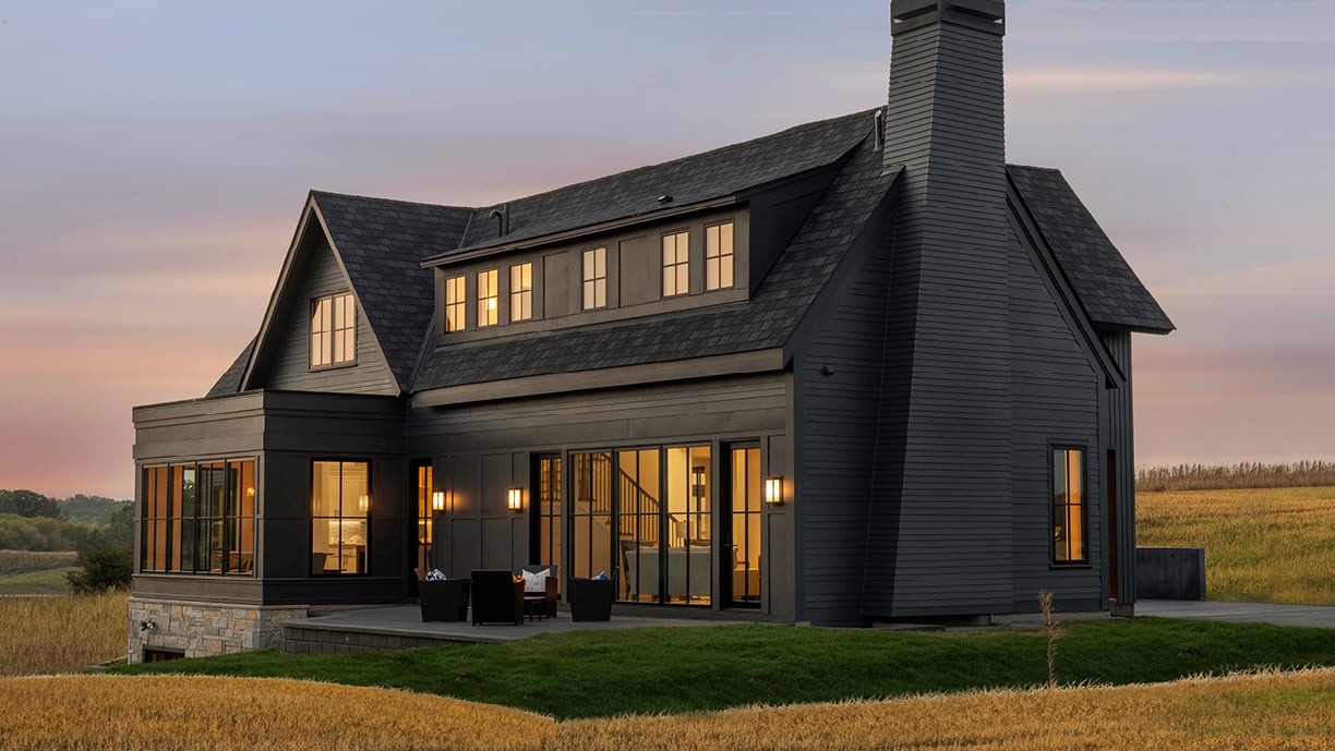 Eye-land home in Stillwater, MN featuring Andersen Windows E-Series casement and picture windows with black exteriors.
