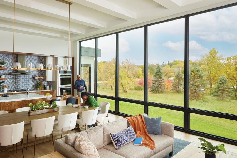 A living room with a window wall made of A-Series Picture Windows joined together with A-Series Awning Windows.