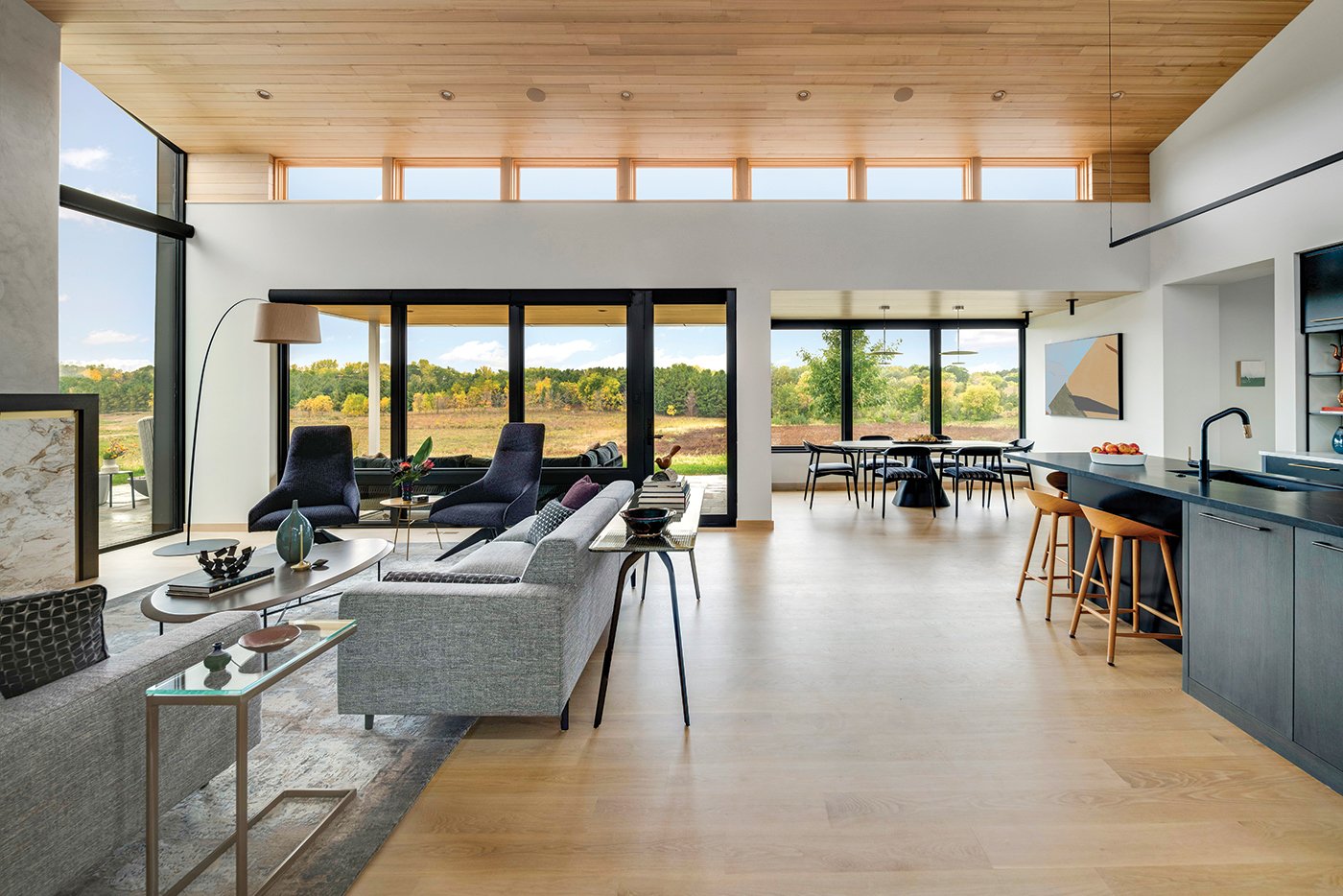 An open-concept living room space with clerestory windows along the roofline.
