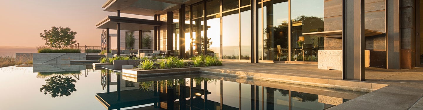 image of exterior pool area with Andersen big doors