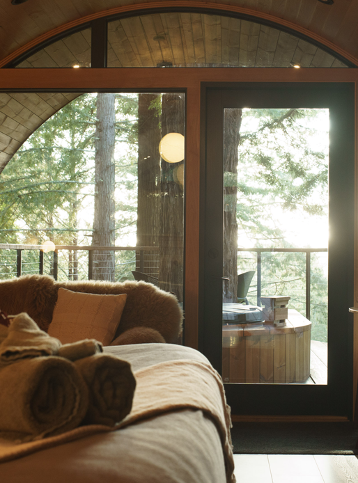 unique living room with amazing curved/arched specialty windows framing in the view of outdoors